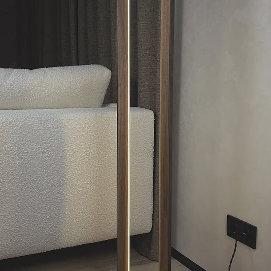 Overview of a handmade floor lamp made of natural walnut wood