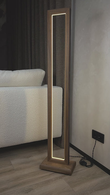 Overview of a handmade floor lamp made of natural walnut wood